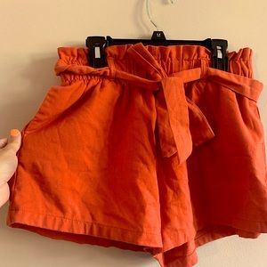 Active USA orange shorts with front bow
